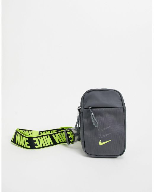 Borsello a tracolla con cinturini con logo, colore grigio e giallo fluo di Nike in Gray