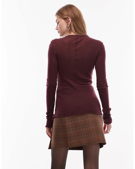 Top manches longues en laine pure avec bords ondulés et trou pour les pouces - bordeaux & Other Stories en coloris Red