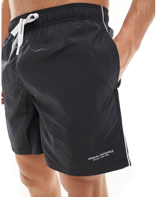 Pantaloncini da bagno lineari neri con logo e profili a contrasto di Armani Exchange in Black da Uomo