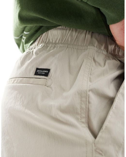 Pantaloni cargo tecnici affusolati ampi beige di Jack & Jones in White da Uomo