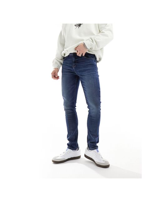 Jeans skinny lavaggio medio di ASOS in Blue da Uomo