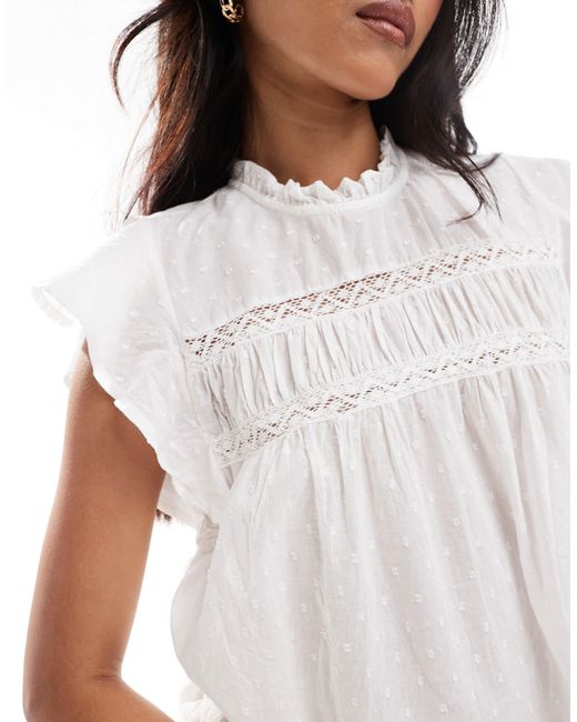 Top avec manches à volants et détails en plumetis ONLY en coloris White