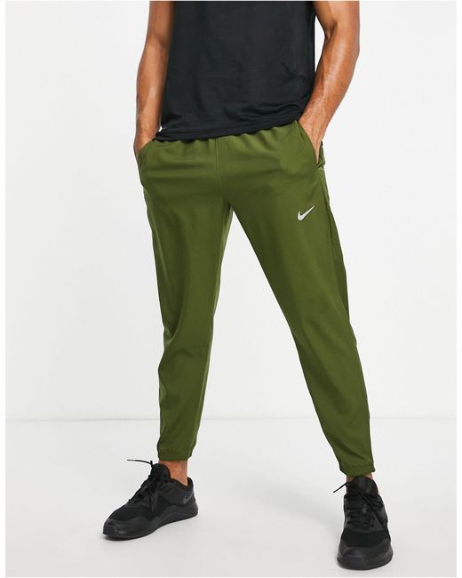 nike dri fit challenger woven pants