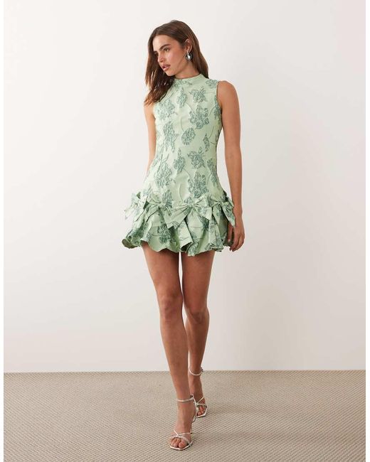 Sister Jane Green Exclusive Jacquard Sleeveless Cinched Waist Bow Hem Mini Dress