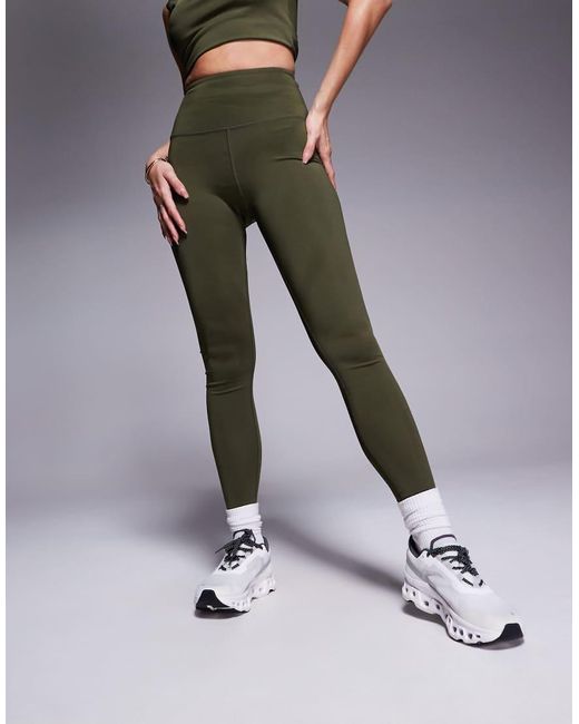 Leggings Deportivos Caquis Con Bolsillo Interior Y Diseño Moldeador En La Parte Trasera Icon De -Verde 4505 de color Green