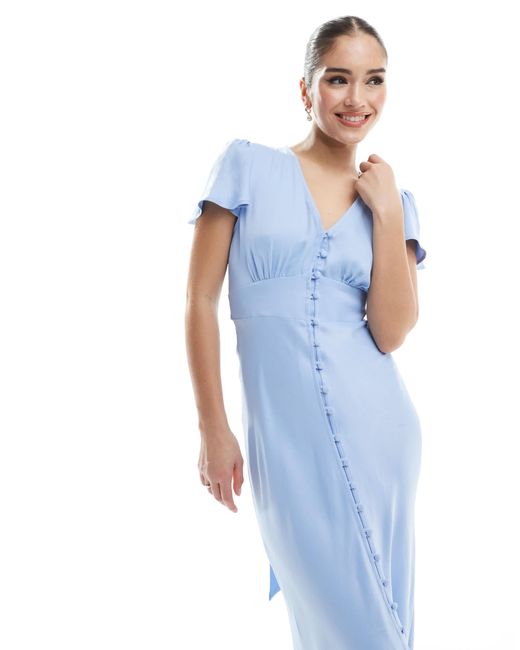 L'invitée - robe longue boutonnée à l'avant - chardon Maids To Measure en coloris Blue