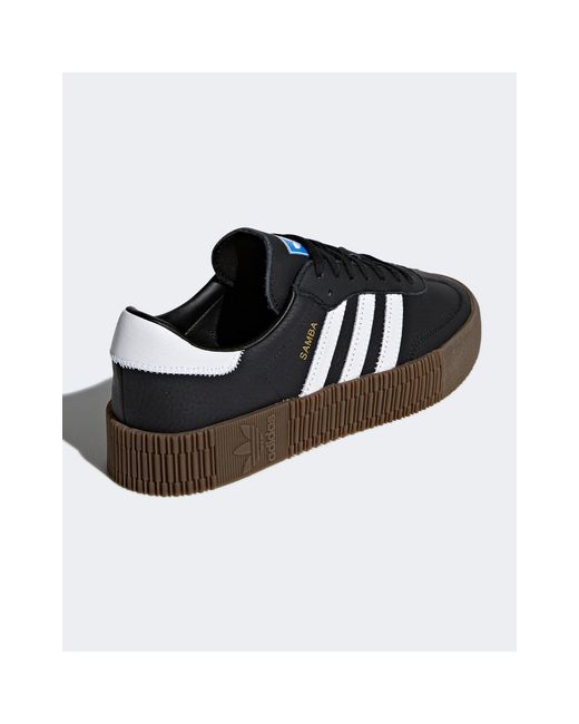 adidas black trainers with white sole