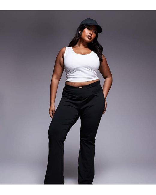 Pantalones De Campana Negros Moldeadores De Talle Alto Con Cinturilla Cruzada De Asos Design Curve ASOS de color Black
