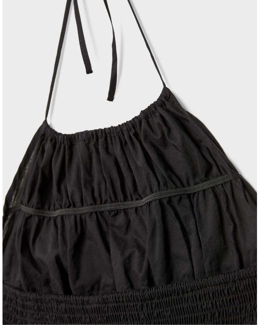 Top dos nu à dos ouvert Stradivarius en coloris Black