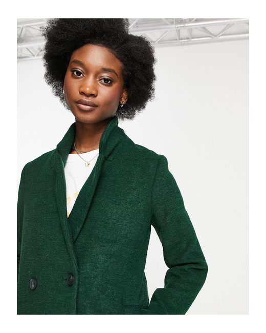 green tailored coat