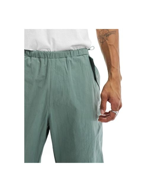 Pantaloni cargo dritti con logo con firma, colore polvere di Karlkani in Green da Uomo