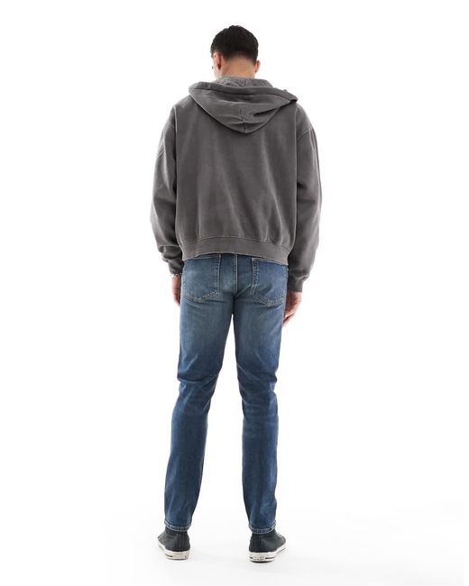 Vaqueros Ajustados En De ASOS de hombre de color Blue