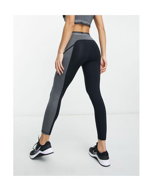 Nike Femme Training Dri Fit High Rise leggings in Blue |