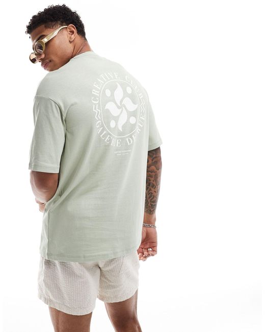 T-shirt oversize con stampa circolare "creative" sul retro di SELECTED in White da Uomo