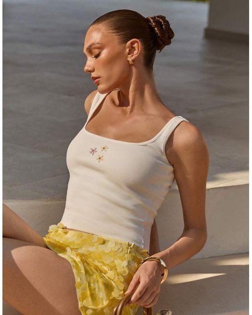 The Frolic White Exclusive Cotton Rich Bead Flower Front Tank Top