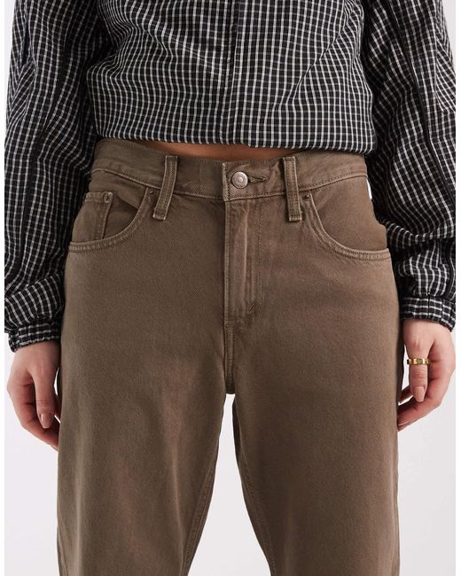 Jean bootcut ample en denim délavé Levi's en coloris Gray