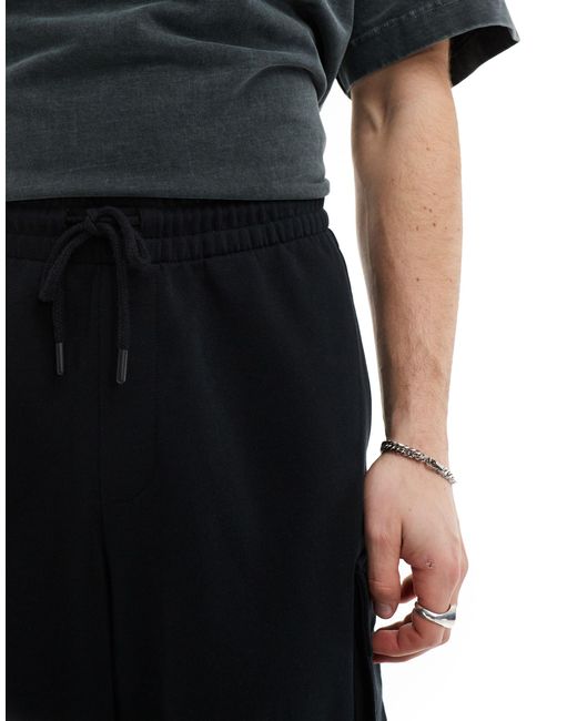 Pantalones cortos 3/4 s estilo paracaidista con 4 bolsillos ASOS de hombre de color Black