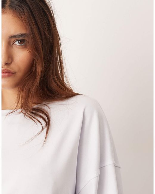 ARRANGE White – langärmliges oversize-t-shirt aus baumwolle