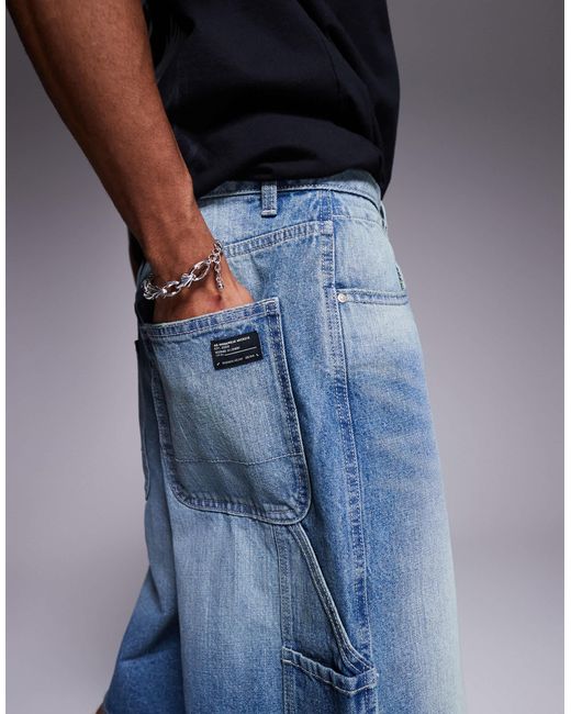 Bermuda long en jean style charpentier - moyen délavé ASOS pour homme en coloris Blue