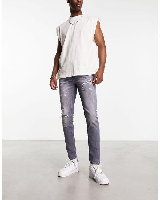 Jack & Jones Intelligence Liam Super Stretch Skinny Fit Jeans With Rip And  Repair in White for Men | Lyst
