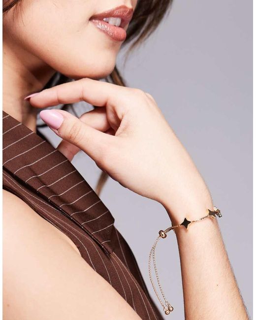 Bracciale Dorato Con Stelle E Chiusura A T-Bar di ASOS in Natural