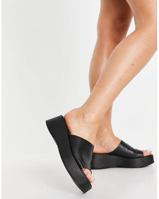 black leather flatforms