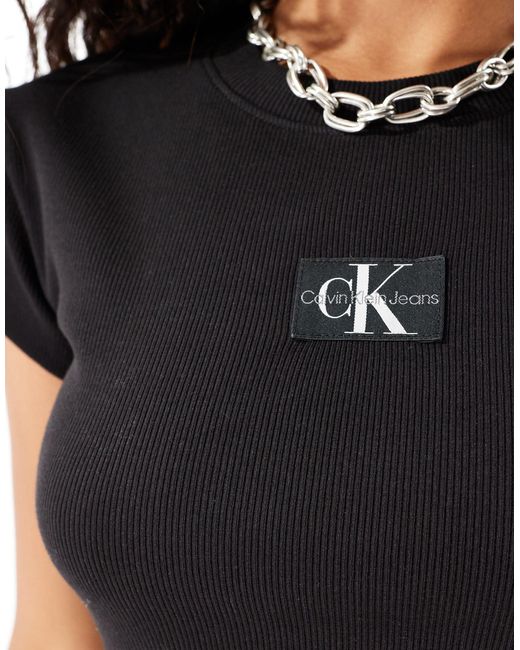 T-shirt baby nera a coste di Calvin Klein in Black