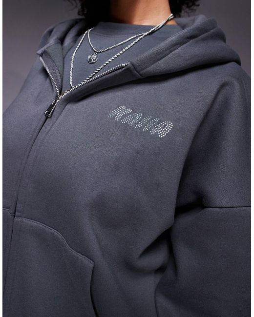 Sweat à capuche d'ensemble zippé en coton majoritaire à logo orné Kaiia en coloris Blue