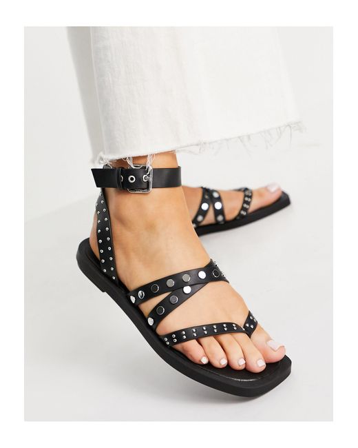 Schuh Black Tale Studded Strappy Toe Post Flat Sandals