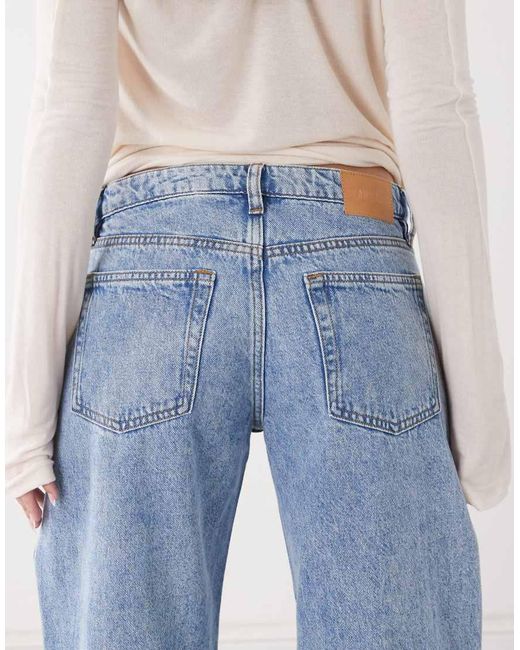 Monki Blue Imoo Low Waist Wide Leg Jeans With Cut Out Bow Details
