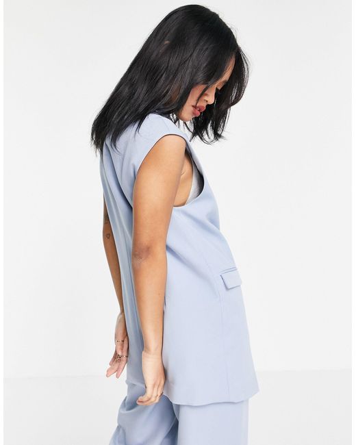 blue sleeveless blazer