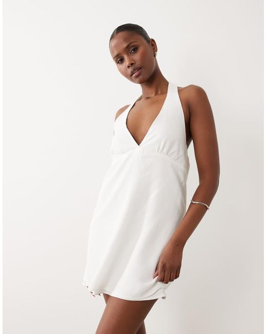 The Frolic White Exclusive Linen Halterneck Mini Dress
