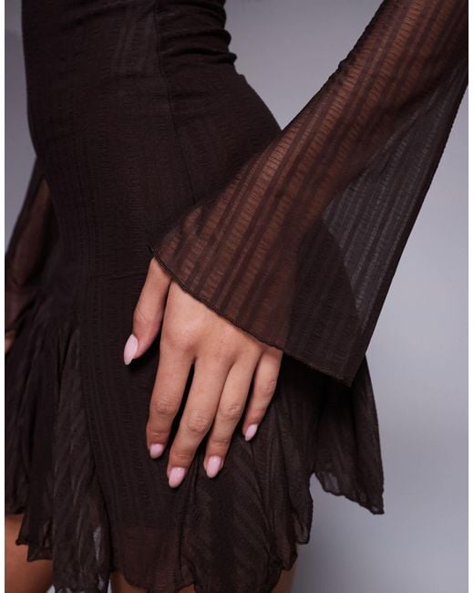 Kaiia Black – exclusive – langärmliges minikleid aus strukturiertem, fließendem mesh mit rüschensaum