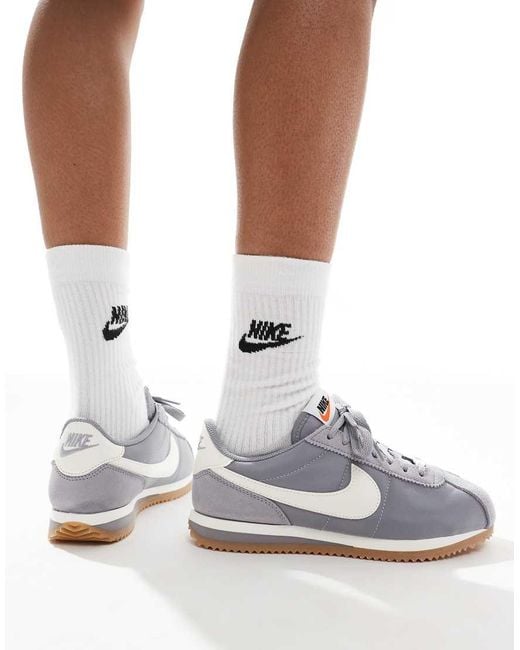 white cortez trainers