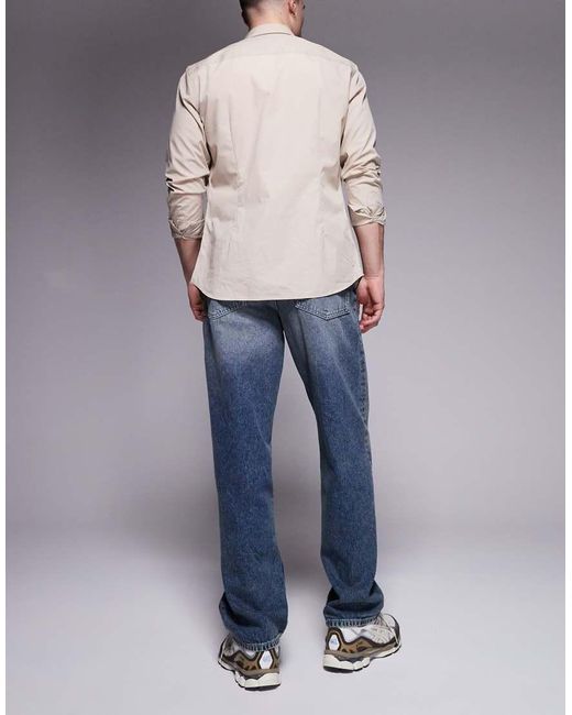 Vaqueros Holgados Con Lavado Azul Oscuro De ASOS de hombre de color Blue