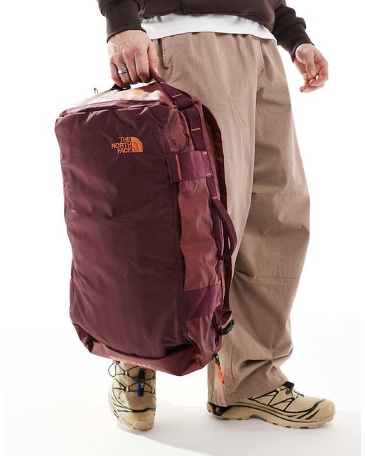 The North Face Red Base Camp Voyager 32L Duffel Bag for men
