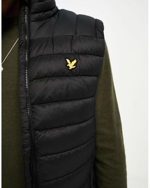 Doudoune sans manches légère à logo emblématique Lyle & Scott pour homme en  coloris Noir | Lyst