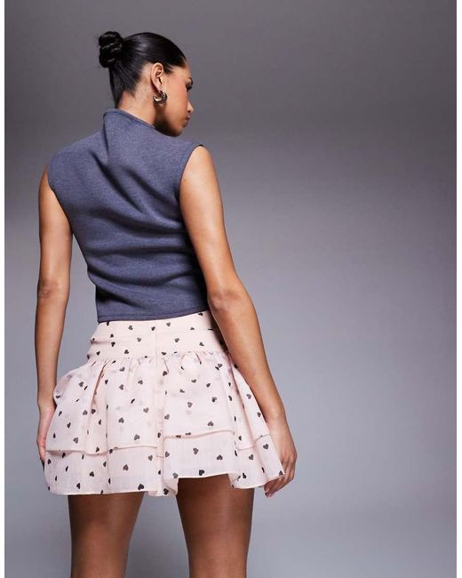 Minifalda Con Estampado De Corazones Y Lazos En La Parte Delantera De ASOS de color Pink