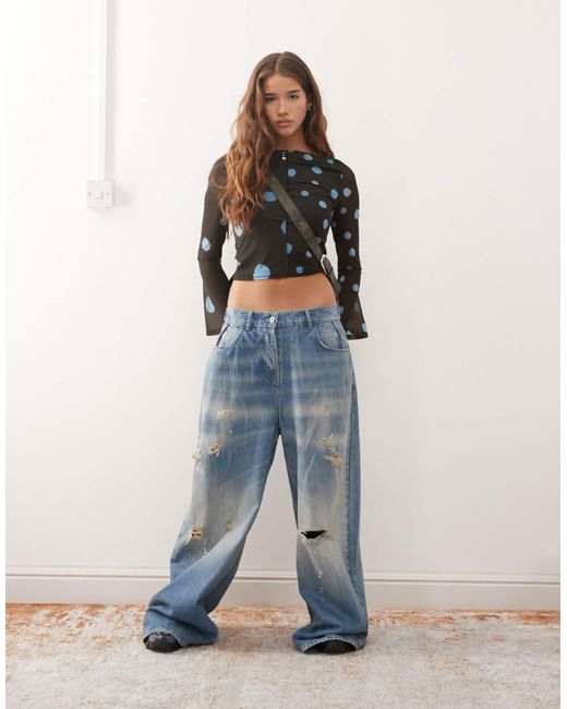 Reclaimed (vintage) Blue Slash Neck Flare Sleeve Top With Spliced Blurred Polka Dot Print