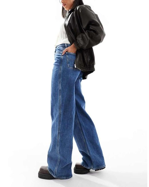 Vaqueros De Talle Alto Y Pernera Ancha Con Lavado Medio Claire De -Azul Tommy Hilfiger de color Blue