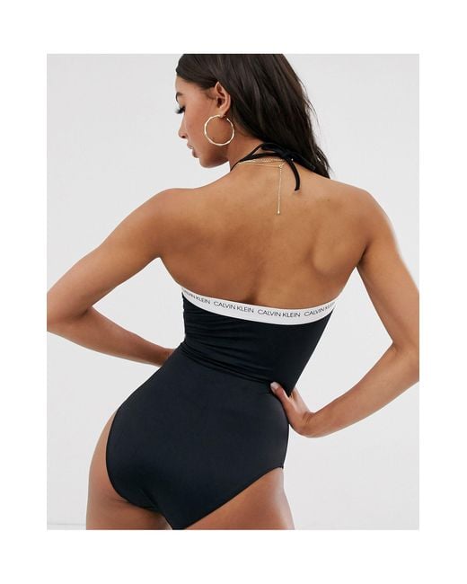 Calvin Klein – Trägerloser Badeanzug mit Logoverzierung und Zierausschnitt  in Schwarz | Lyst AT