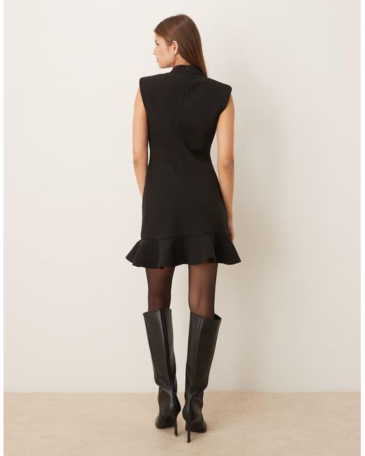 Mango Hoogsluitende Mouwloze Mini-Jurk Met Structuur En Peplumzoom in het Black