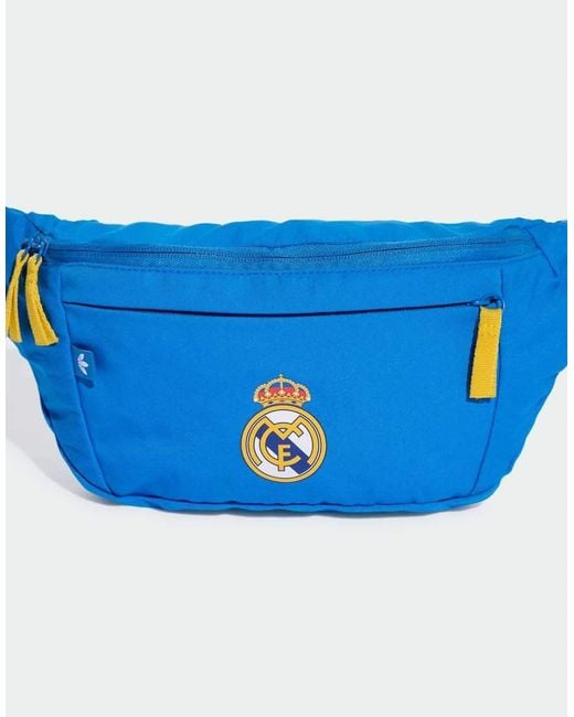 Riñonera Azul Pájaro Y Dorada Con Diseño Del Real Madrid De Adidas Originals de color Blue