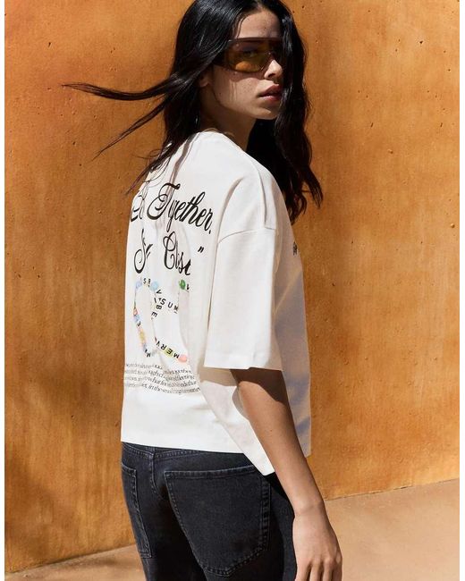 T-Shirt A Maniche Corte Bianca Con Stampa di Bershka in White