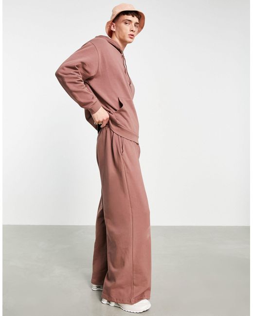 Joggers oversize a fondo ampio slavato da Uomo di ASOS in Marrone | Lyst