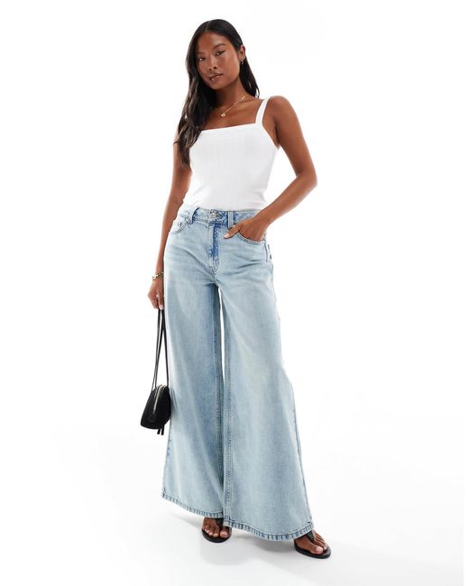 Asos design petite - jean ample à taille haute - délavage vintage ASOS en coloris Blue