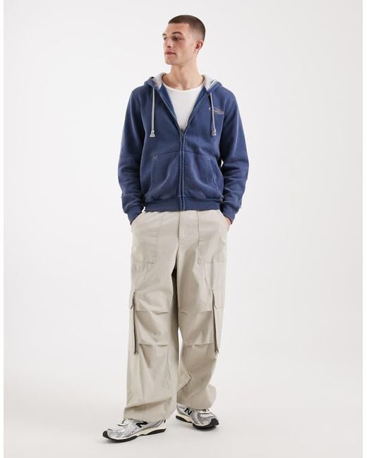 Hollister Blue Zip Up Hoodie With Sleeve Graphic Detail for men