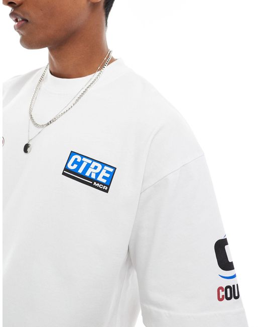 Camiseta blanca con estampado gráfico estilo motocross The Couture Club de hombre de color White