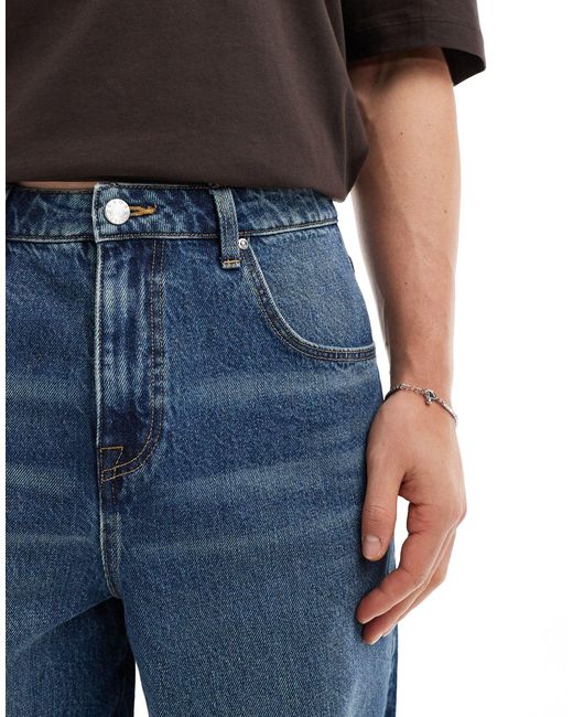 Jorts di jeans taglio standard con fondo grezzo lavaggio medio di ASOS in Black da Uomo