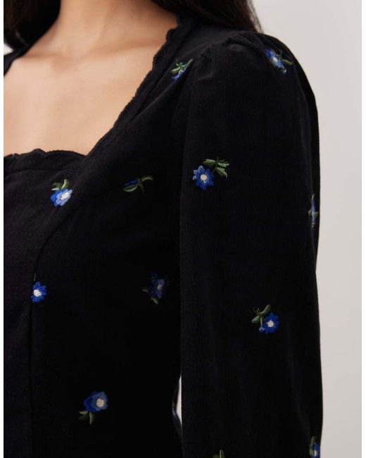 Vestido Corto Negro Con Bordado Floral, Botones Delanteros Y Ribetes Festoneados De Pana Memphis De Nobody's Child de color Black